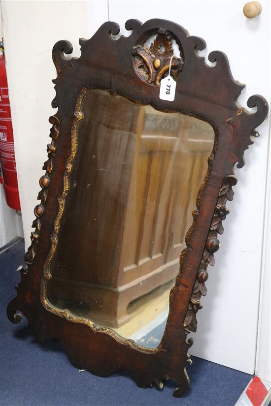 An early 18th century fret frame wall mirror W.55cm H.93cm